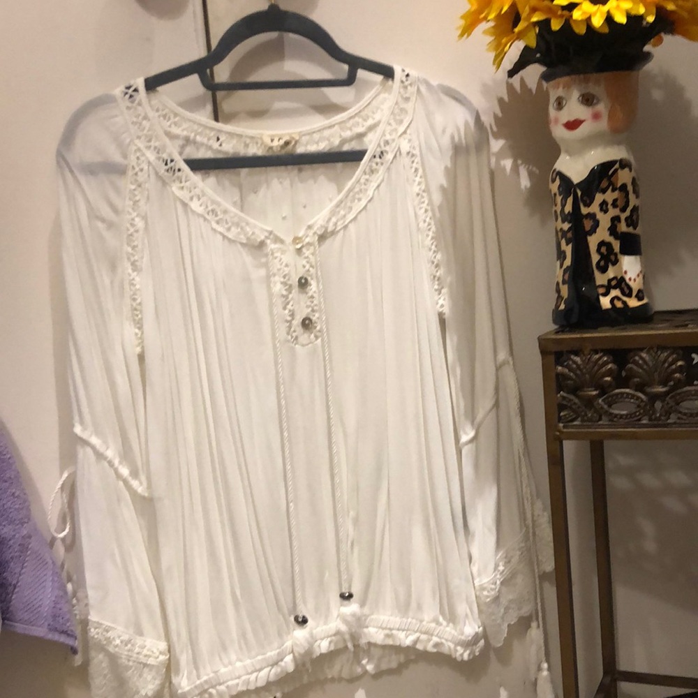 POL. Bohemian top trimmed with lace on sleeves and around neck-tassels too!